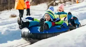 imgi 137 winter happenings kids sledding on snow tube at camelback resort 8e1c20